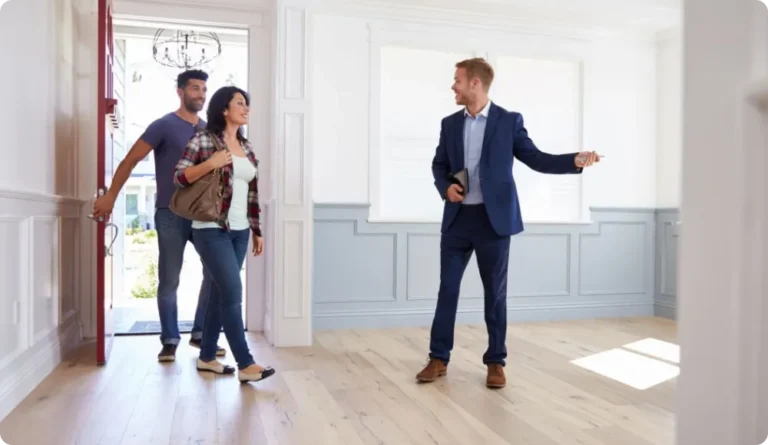 Estate Agent Showing A Couple A New Home